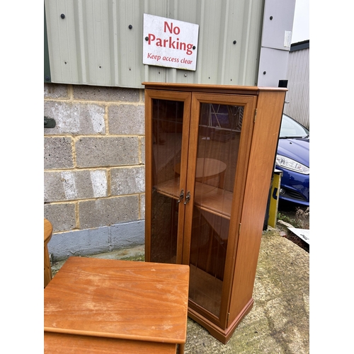 209 - A teak cabinet, teak nest of three and occasional table