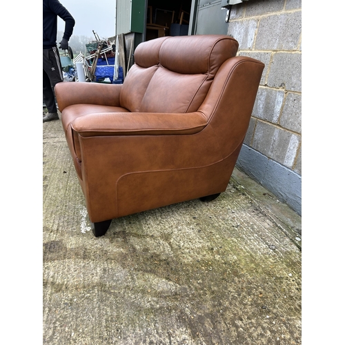 212 - A good quality soft brown leather two seater sofa by PARKER KNOLL approx one year old, still with la... 