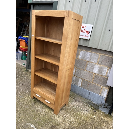 217 - A modern light oak open bookcase with drawer 75x40x175