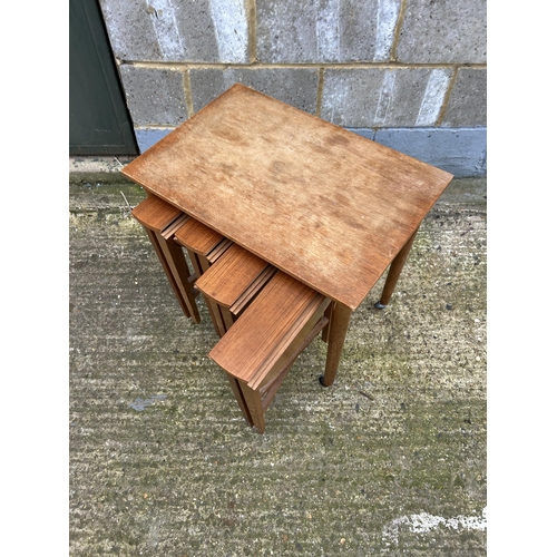 223 - A mid century teak nest of five