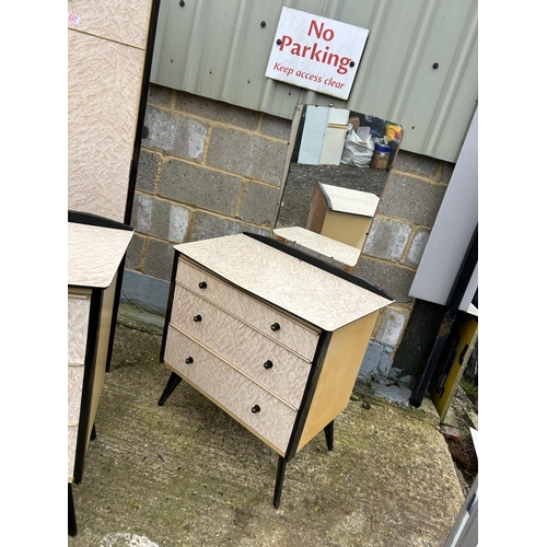 227 - A mid century three piece bedroom suite consisting of a wardrobe, dressing chest and chest of drawer... 