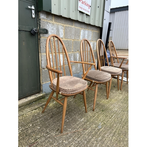 247 - A set of four ercol light elm stick back dining chairs (inc 2 carvers)