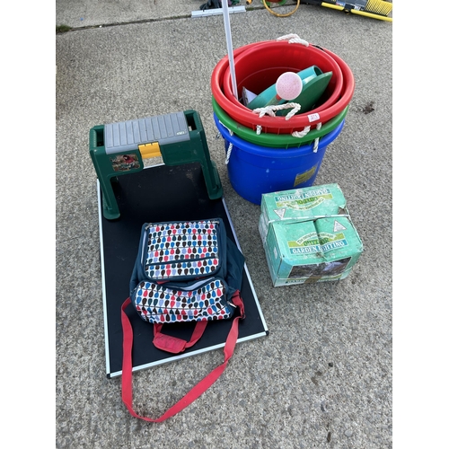 271 - Four large muck buckets, kneeler, folding table, picnic set and garden lights