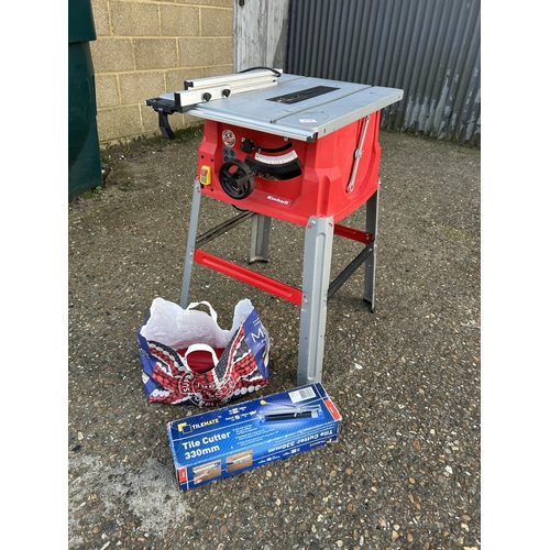 316 - An EINHELL table saw with bag of attachments