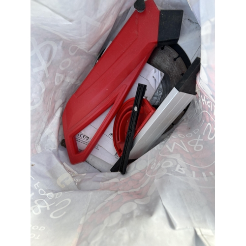 316 - An EINHELL table saw with bag of attachments