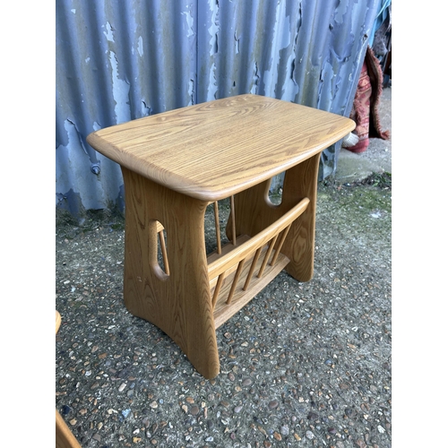 34 - A modern ercol light elm nest of three together with matching side table