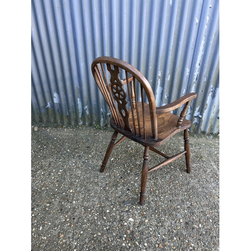 36 - A wheelback carver chair