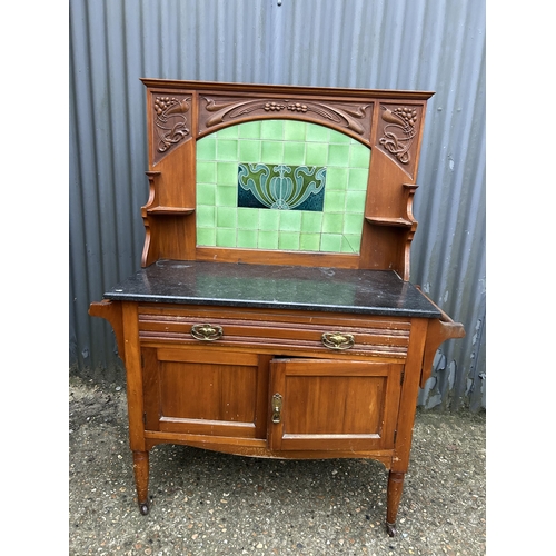 5 - An Edwardian satinwood wash stand with marble too and green tiled back