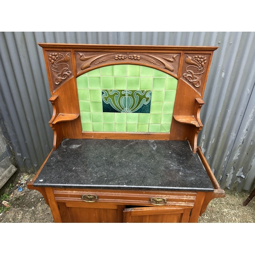 5 - An Edwardian satinwood wash stand with marble too and green tiled back