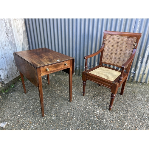 51 - A mahogany campaign style chair together with mahogany Pembroke table