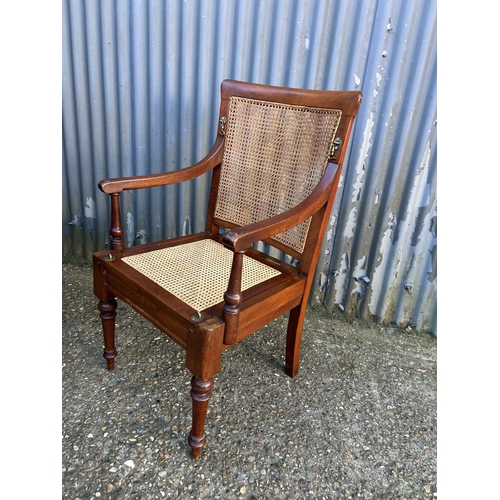 51 - A mahogany campaign style chair together with mahogany Pembroke table