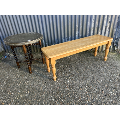 54 - An oak barley twist table with brass tray together with a beach bench seat