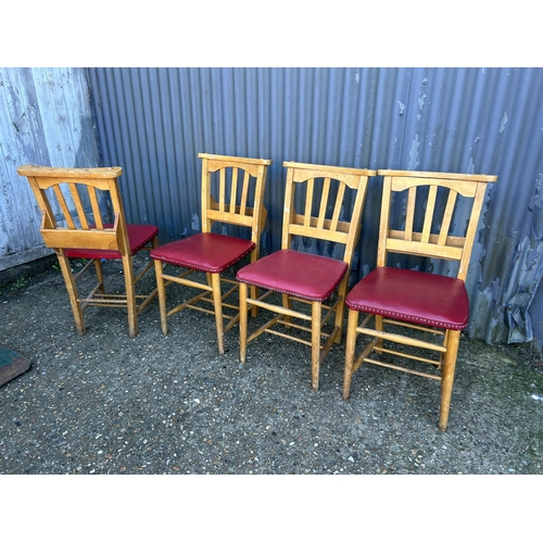 62 - A set of four chapel chairs