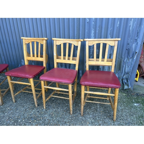 62 - A set of four chapel chairs