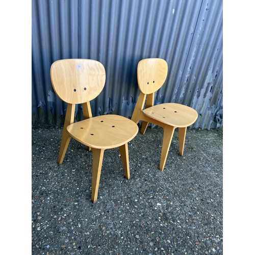 64 - A pair of modern ply butterfly back chairs