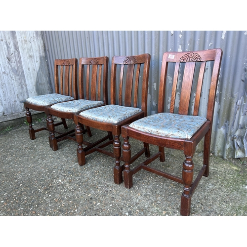 65 - A set of four 1920's oak dining chairs with drop in seats