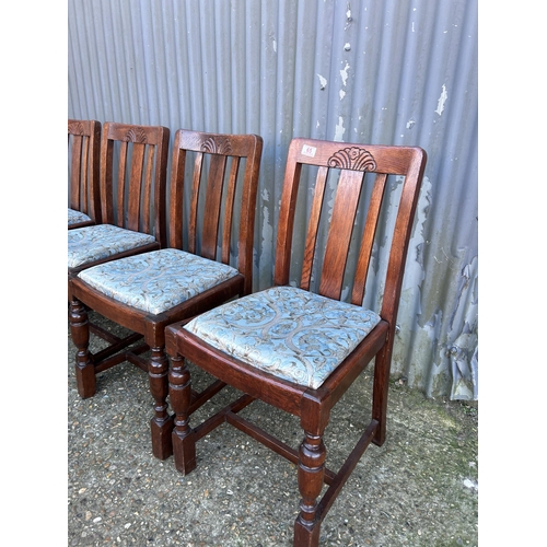 65 - A set of four 1920's oak dining chairs with drop in seats