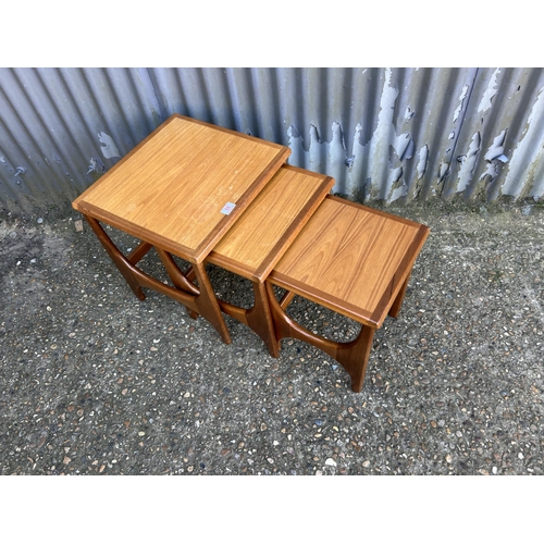 66 - A teak nest of three tables