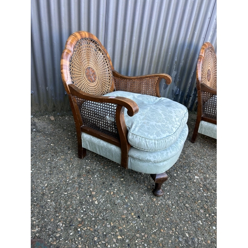 68 - A pair of Edwardian begere salon chairs with blue cushion seats