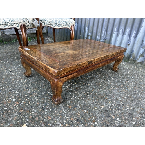 69 - A rustic style coffee table and a pair of Victorian balloon back chairs