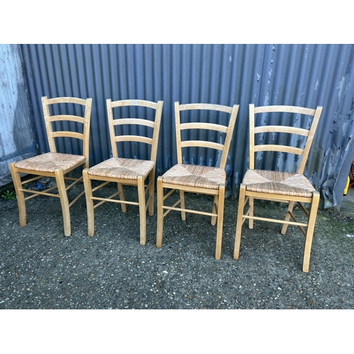 71 - A set of four farmhouse kitchen chairs with rush seats