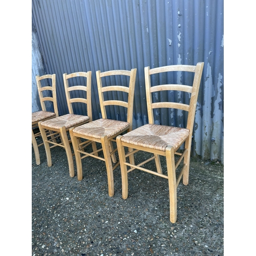 71 - A set of four farmhouse kitchen chairs with rush seats