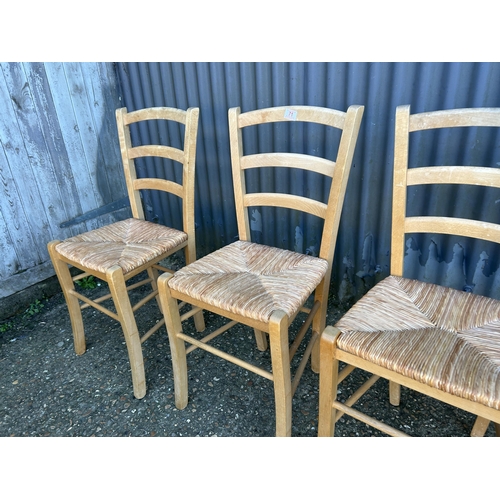 71 - A set of four farmhouse kitchen chairs with rush seats