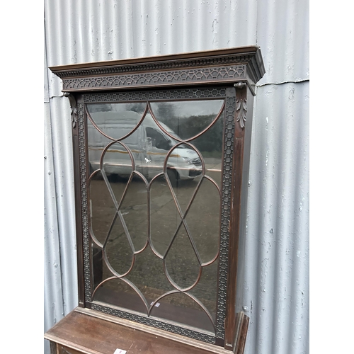 8 - An ornate single door mahogany cabinet on stand