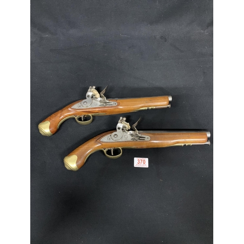 370 - A good quality pair of vintage reproduction Flintlock Pistols each length 40 cms