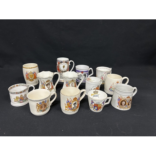 560 - Collection of 13 commemorative mugs