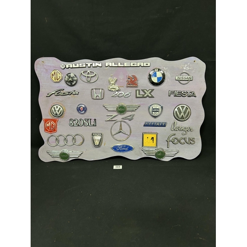 568 - Display board of car badges, 78 x 48cms