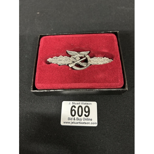 609 - Museum copy of metal combat badge