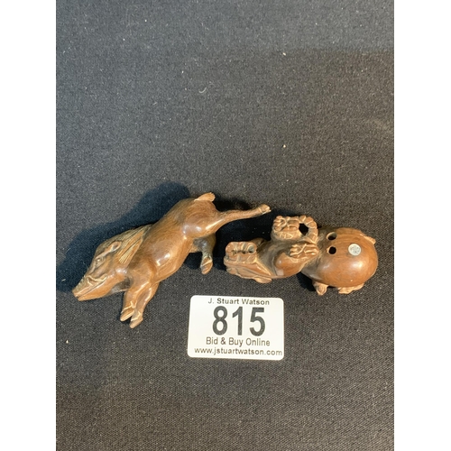 815 - Two signed oriental carved wooden animal Netsuke