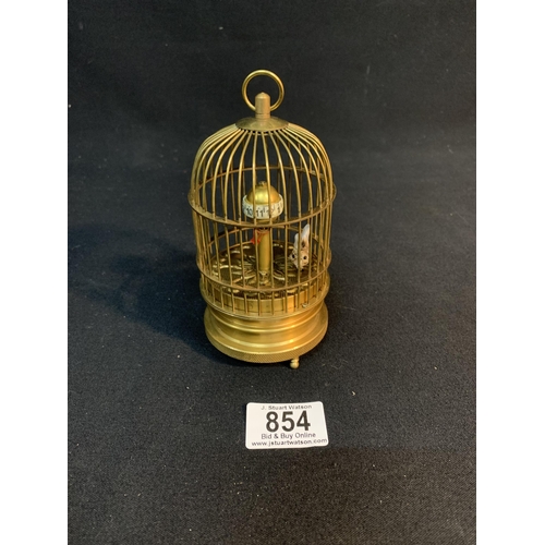 854 - Brass automata bird cage clock,height 15cm ,working.