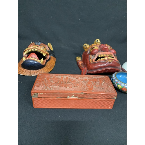 875 - Two carved wooden face masks, cinnabar box a/f, two plates and cloisonné bowl