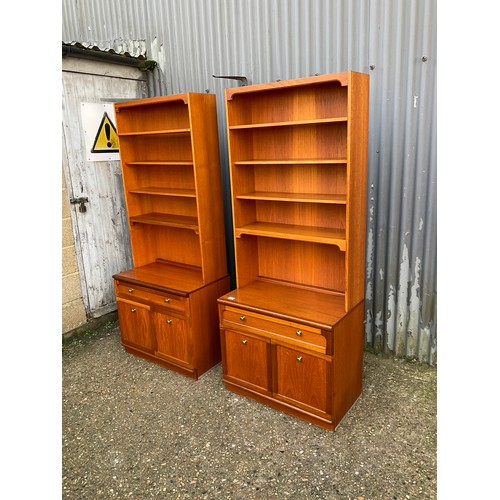 143 - A pair of mid century teak bookcases with open tops, over single drawer base