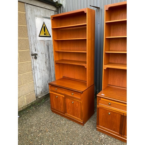 143 - A pair of mid century teak bookcases with open tops, over single drawer base