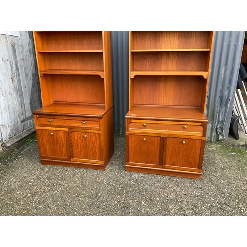 143 - A pair of mid century teak bookcases with open tops, over single drawer base