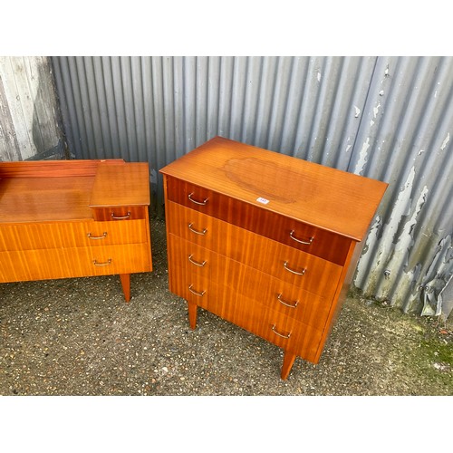 145 - A mid century teak bedroom pair consisting of chest of drawers and matching desk