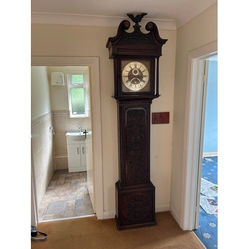 170 - An oak carved long case clock with brass dial by HENRY FISHER OF PRESTON