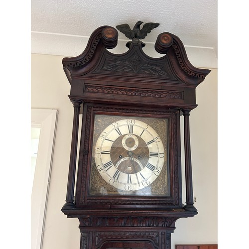 170 - An oak carved long case clock with brass dial by HENRY FISHER OF PRESTON