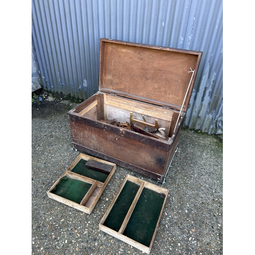 100 - A large vintage pine tool chest with saws and block planes