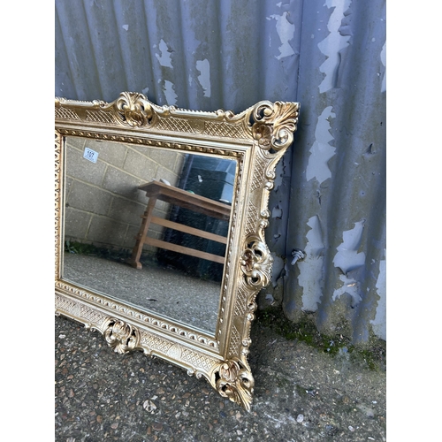 107 - Two highly ornate gold gilt wall mirrors