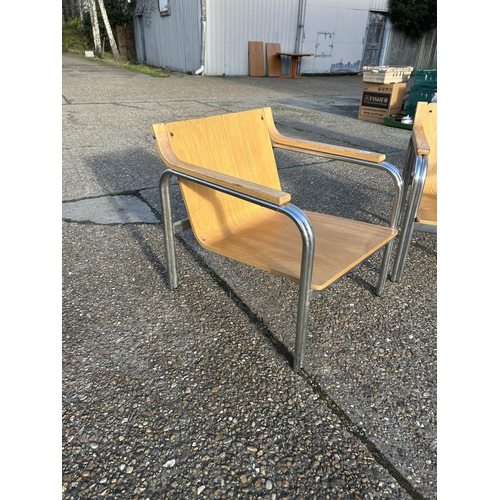 116 - A pair of chrome framed armchairs with bent ply seats