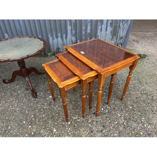 123 - A yew nest of three together with reproduction coffee table and a  sewing box