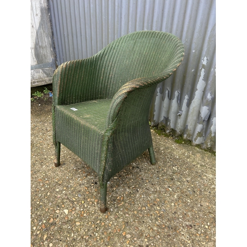 129 - An original green painted lloyd loom bedroom chair