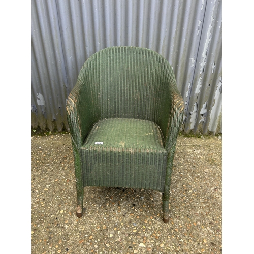 129 - An original green painted lloyd loom bedroom chair