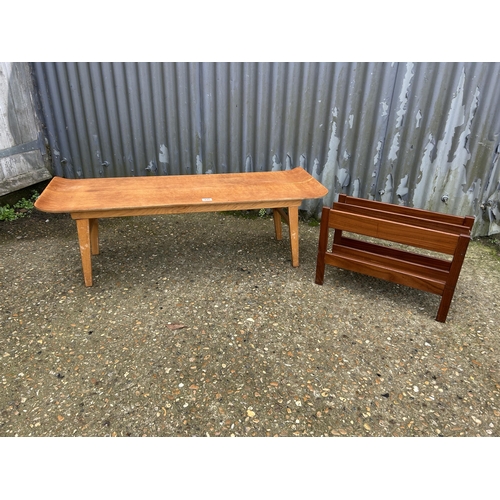 131 - A retro light oak coffee table together with a danish style teak magazine rack