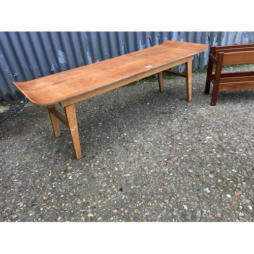 131 - A retro light oak coffee table together with a danish style teak magazine rack