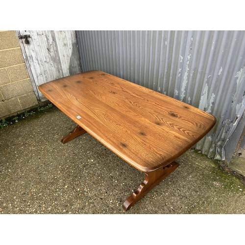 136 - An ercol golden dawn refectory dining table 180x87x77